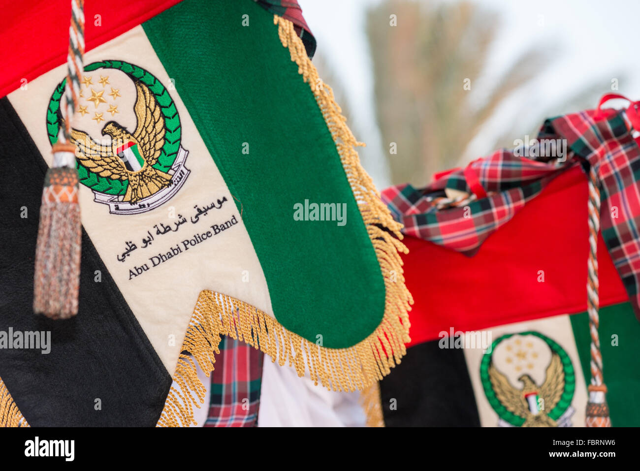 Bagpipe banner for a musician in the Abu Dhabi Police Band Stock Photo