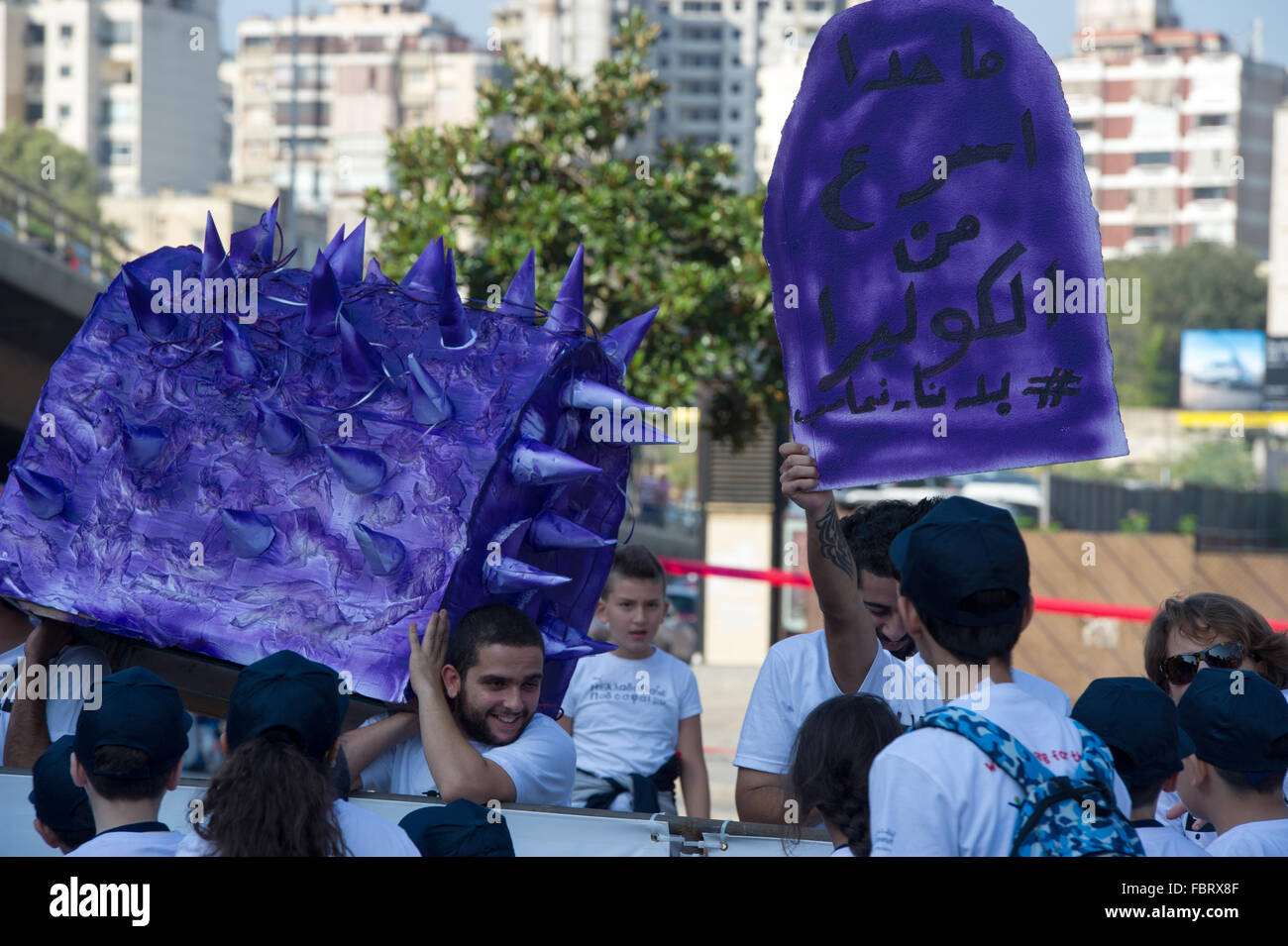 Cholera disease warning form status hold by activist in Beirut Lebanon Stock Photo