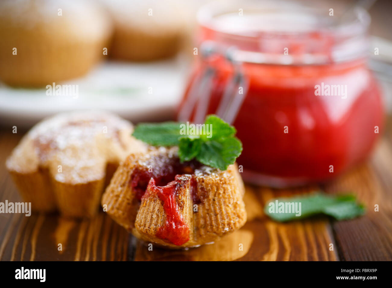 sweet muffins with fruit jam inside Stock Photo Alamy