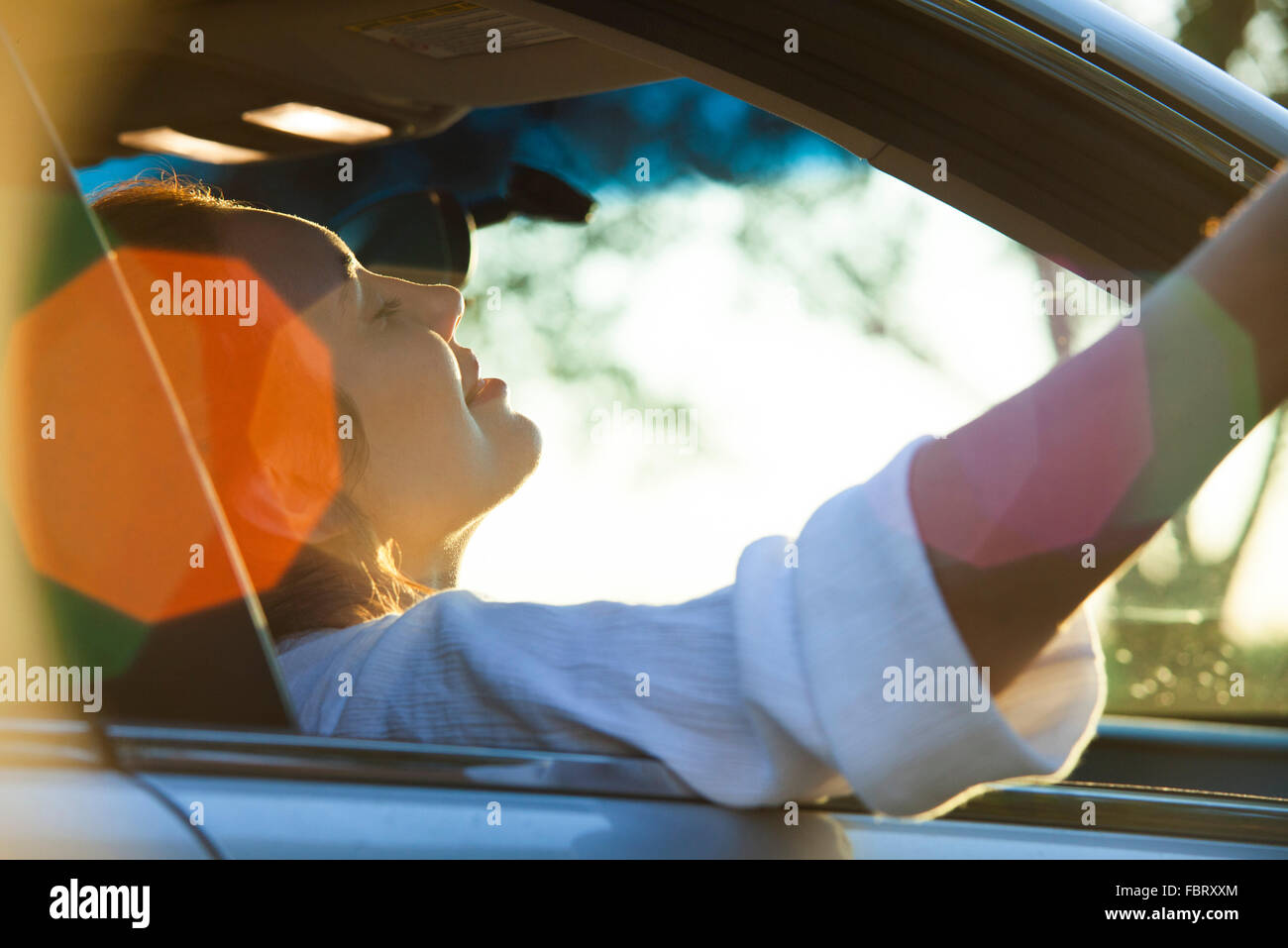 Woman passenger riding in car Stock Photo