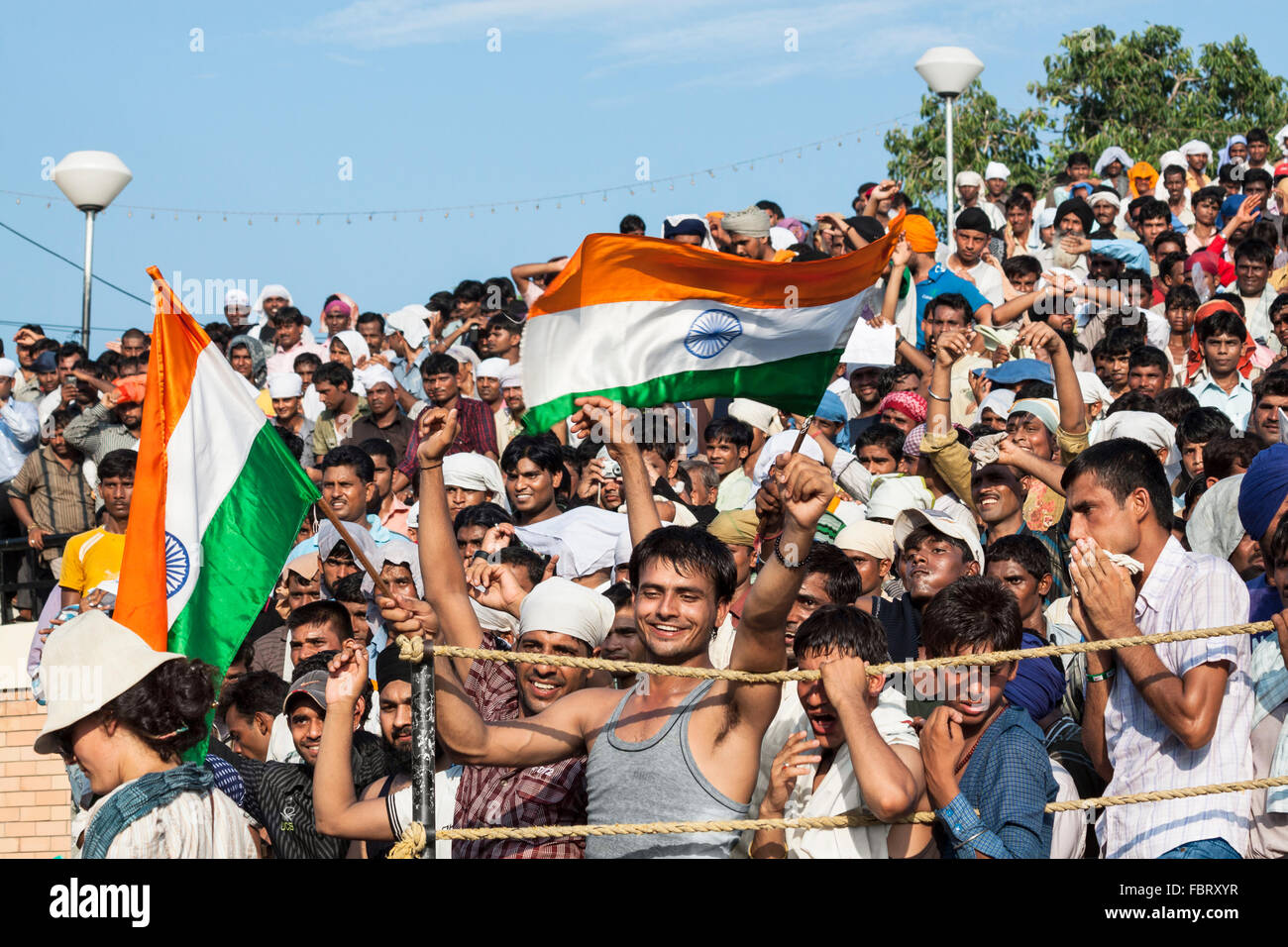 The people cheering ceremony of Indian-Pakistani border crossing. Wagah,Attari Border, Punjab, India. Stock Photo