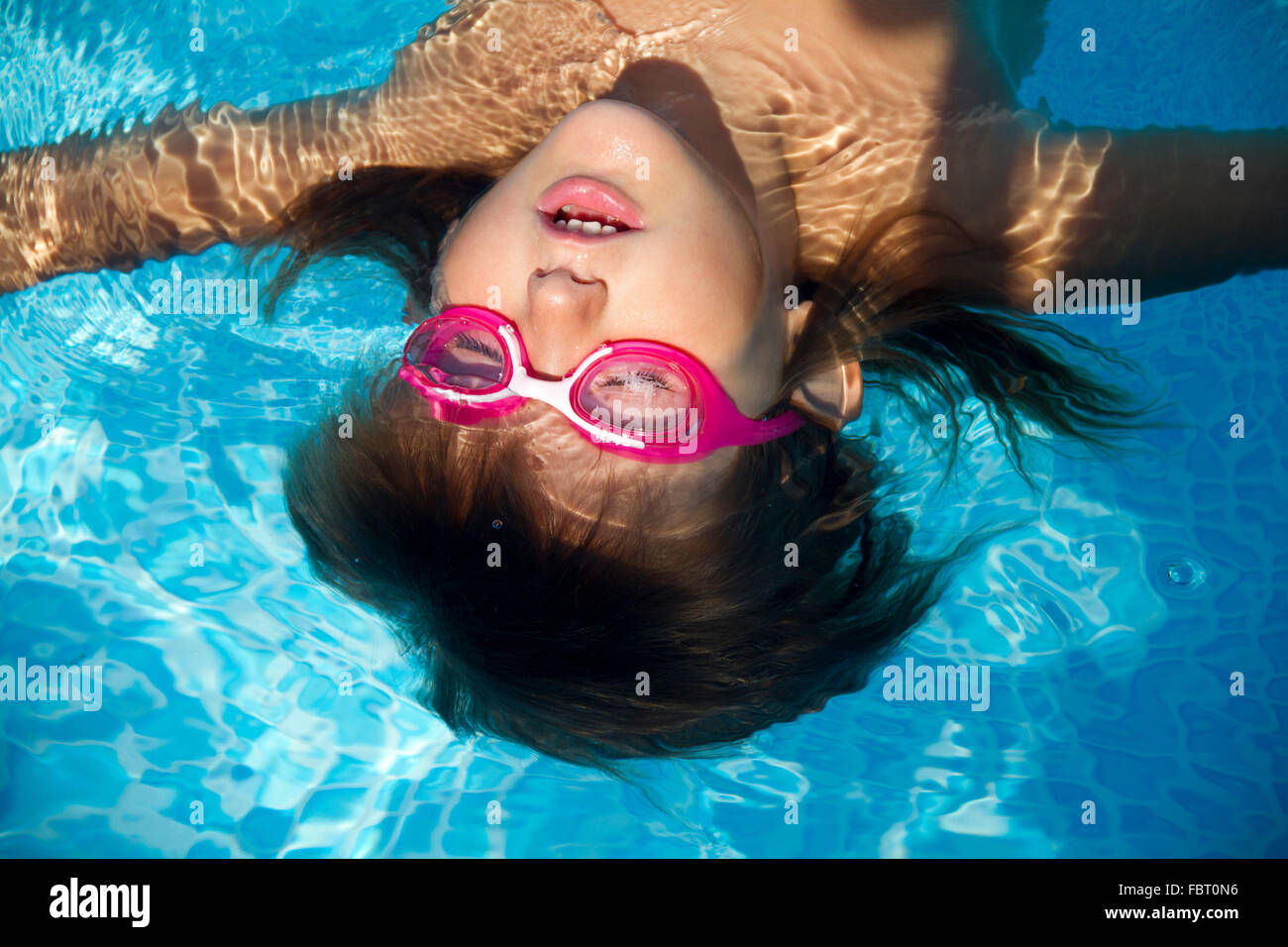 A young girl relax in a pool Stock Photo - Alamy