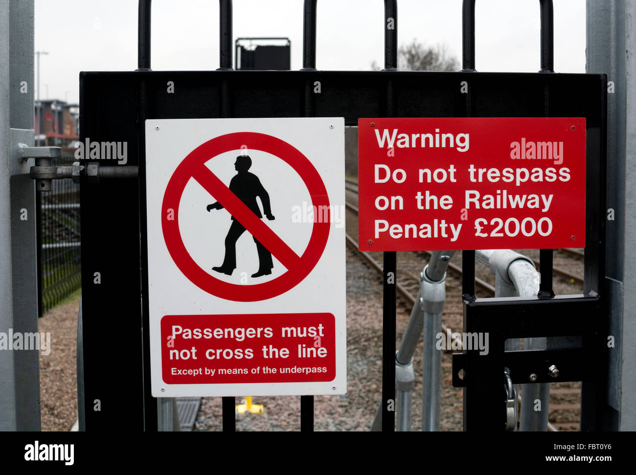 Trespass and safety signs at Coventry Arena railway station, Coventry, West Midlands, England, UK Stock Photo