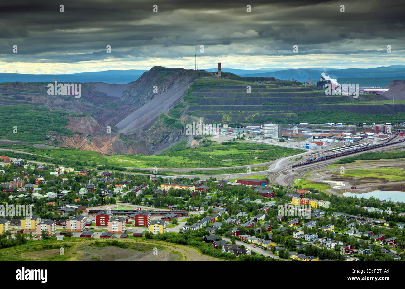 Sweden, Lapland, Kiruna, View of city and iron ore mountain in background Stock Photo