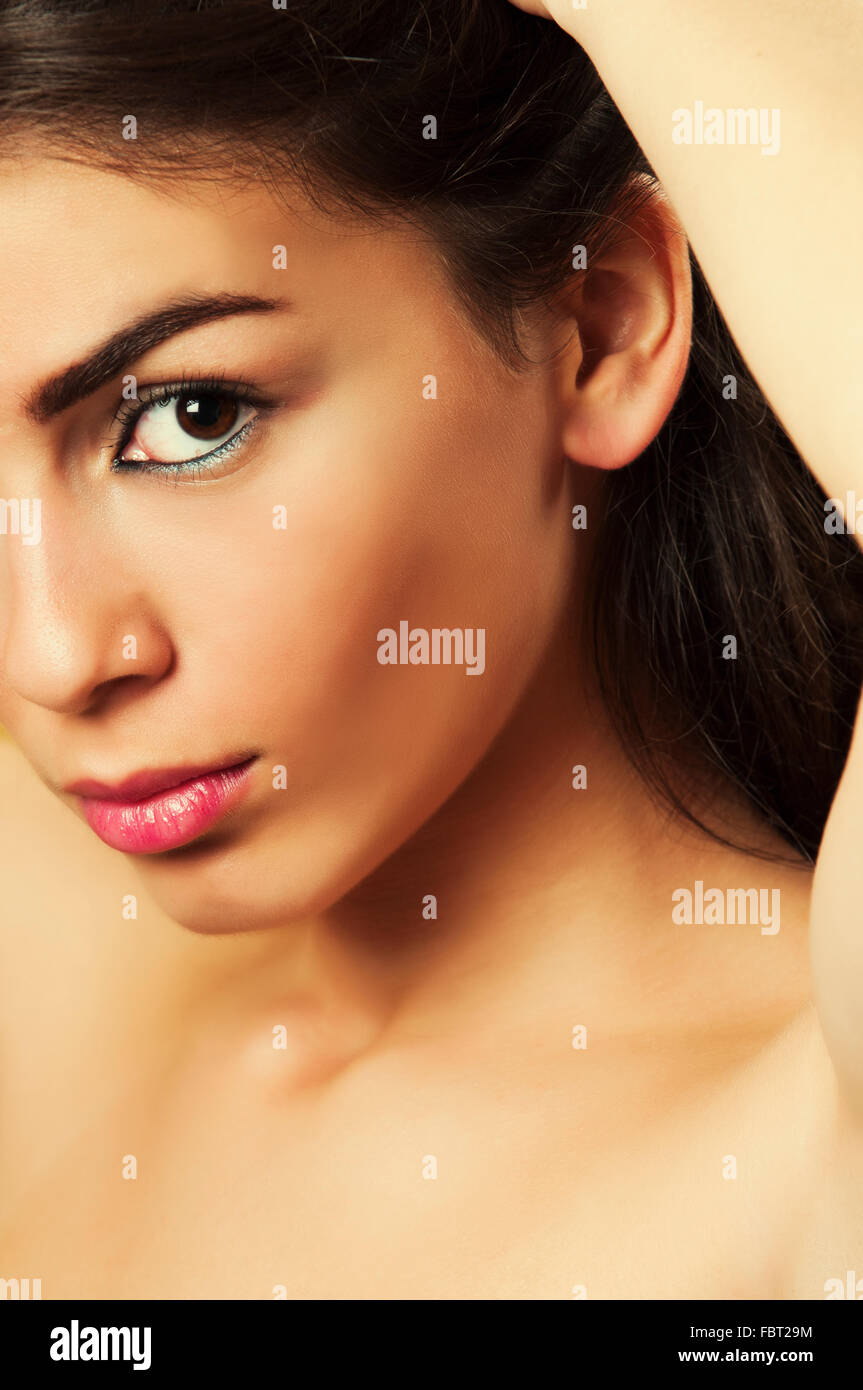 Close up of a beautiful young woman staring Stock Photo