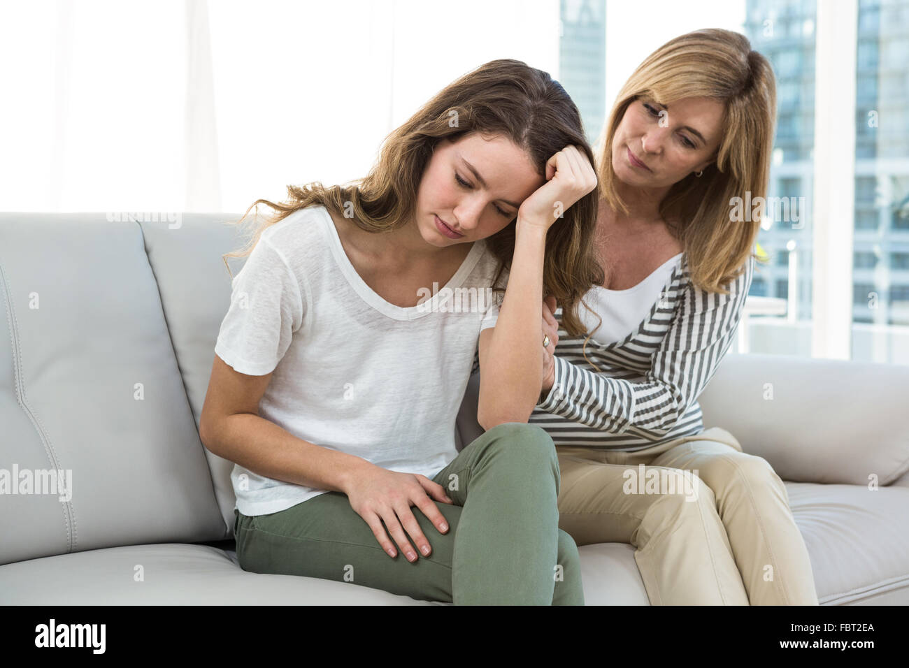 Sad daughter against mother Stock Photo Alamy