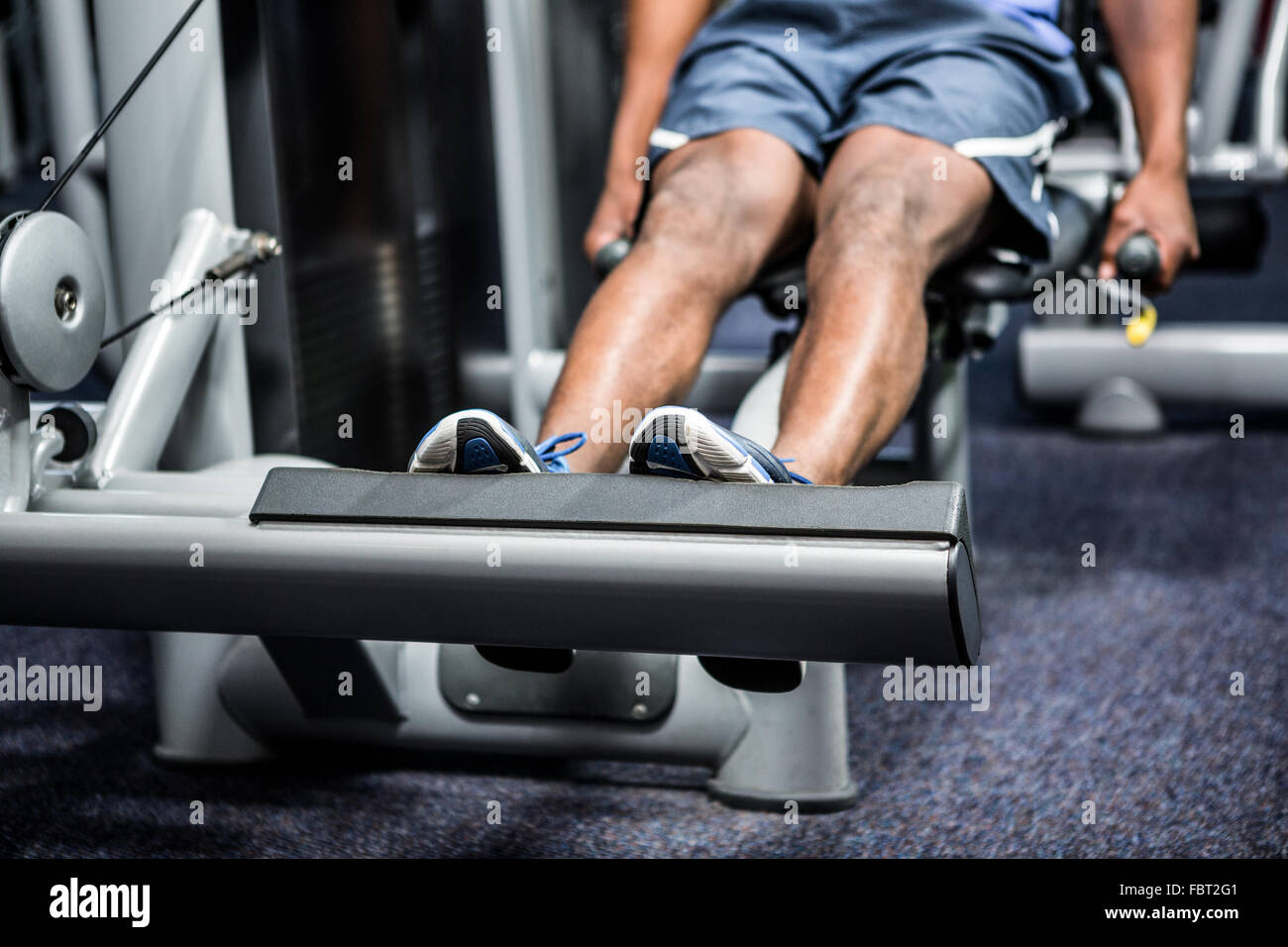 Cropped image of man using exercise machine Stock Photo