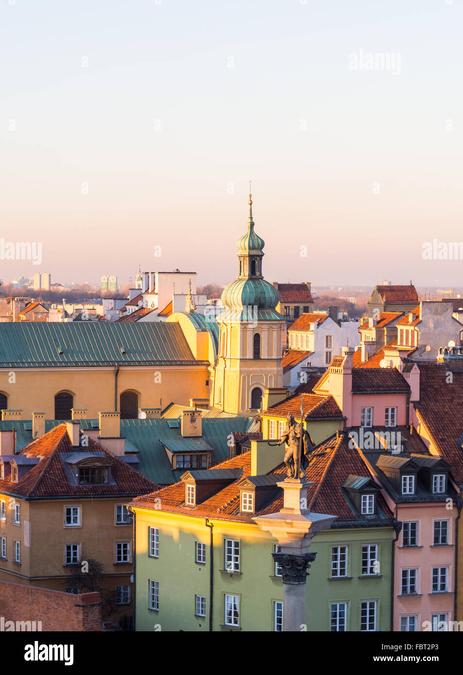 Traditional architecture in the Old Town of Warsaw, Poland, seen from the viewing terrace on the saint Anna's church, at sunset. Stock Photo