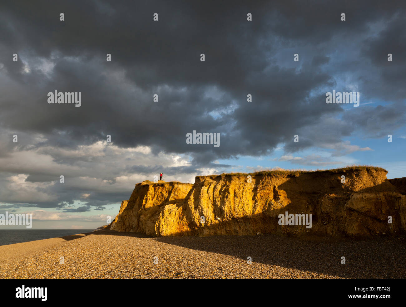 Female standing cliff top hi-res stock photography and images - Alamy