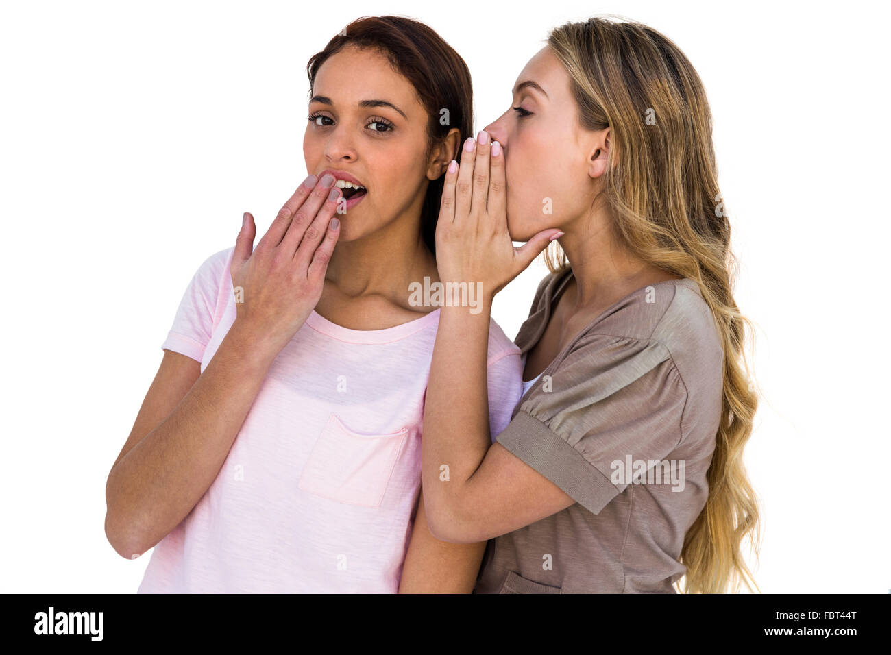 Girls whispering Stock Photo Alamy