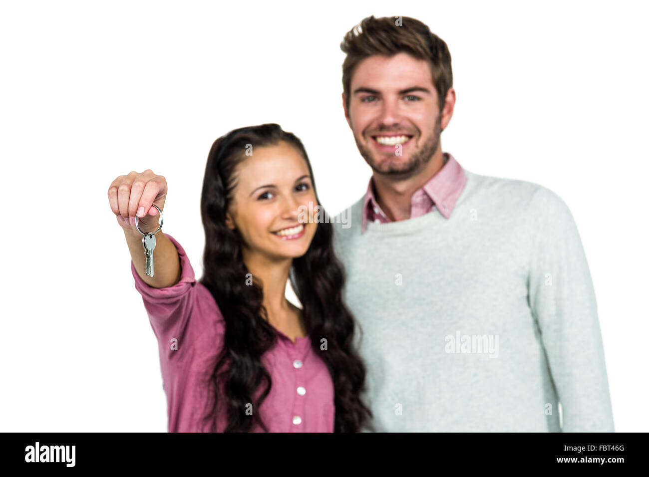 Portrait of happy couple holding keys Stock Photo - Alamy