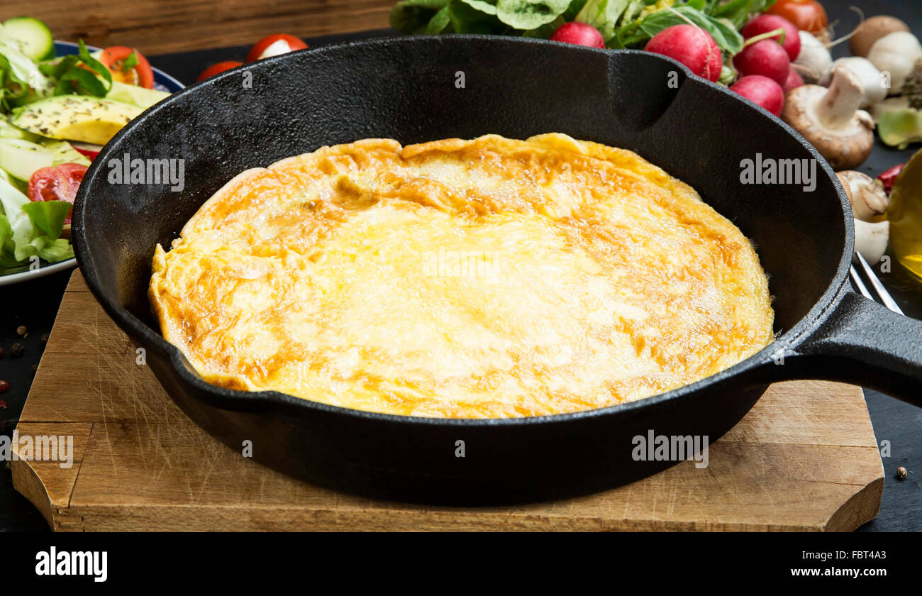 Omelette in a frying pan with vegetables , healthy meal Stock Photo
