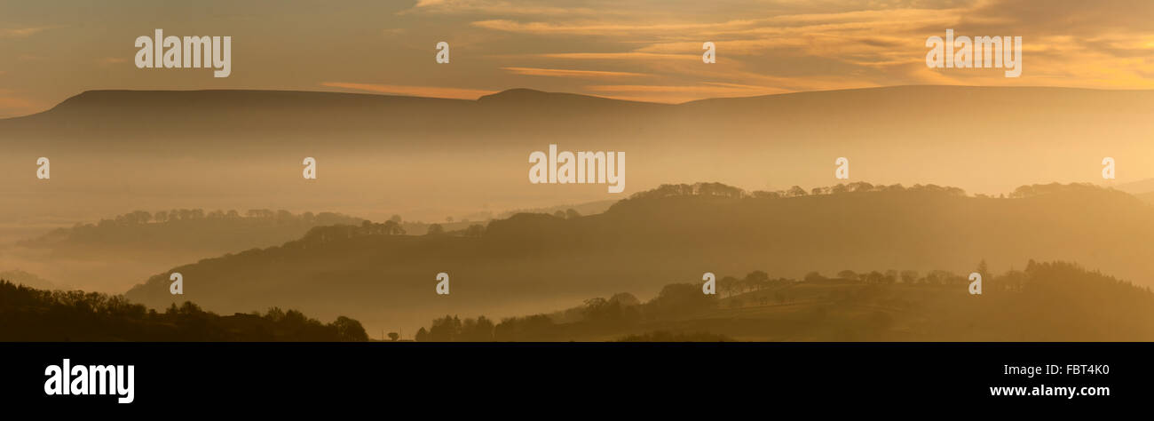Powys, UK. 19th Jan, 2016. A view over the rolling hills of Mid Wales toward Hay Bluff and The Black Mountains (Powys) at sunrise. Credit:  Graham M. Lawrence/Alamy Live News. Stock Photo