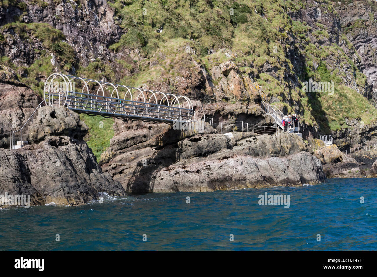 Northern Ireland tourist attraction - people on the Gobbins Cliff Path walk in County Antrim, Northern Ireland. Stock Photo