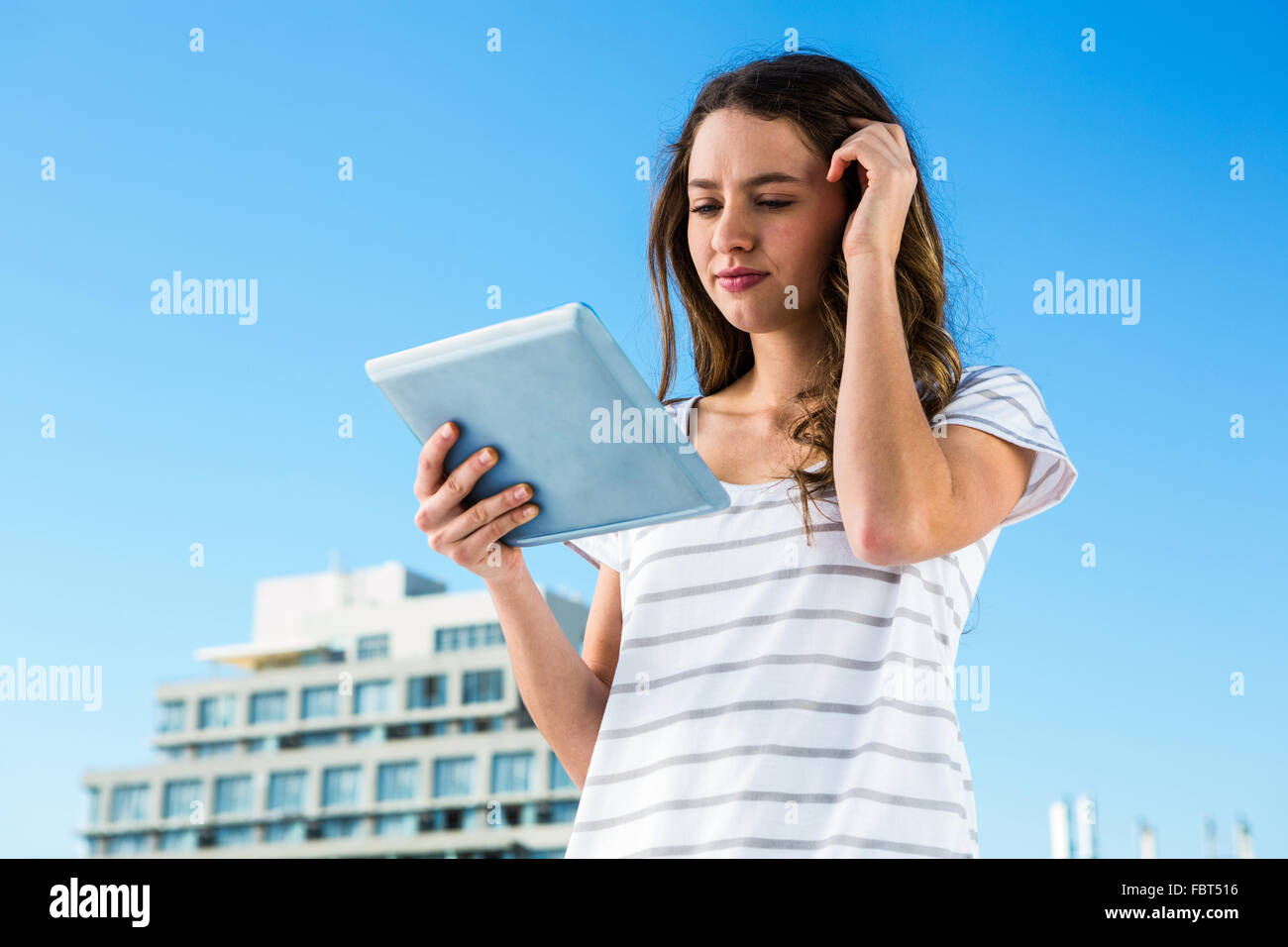 Young girl using her tablet Stock Photo