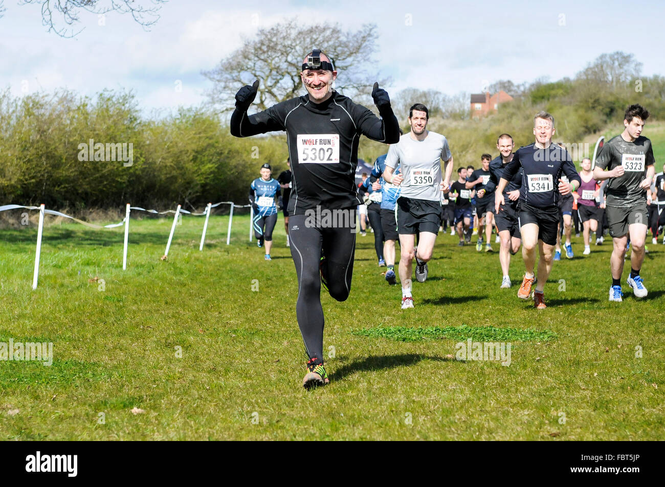Runners at obstacle course race, UK Stock Photo Alamy