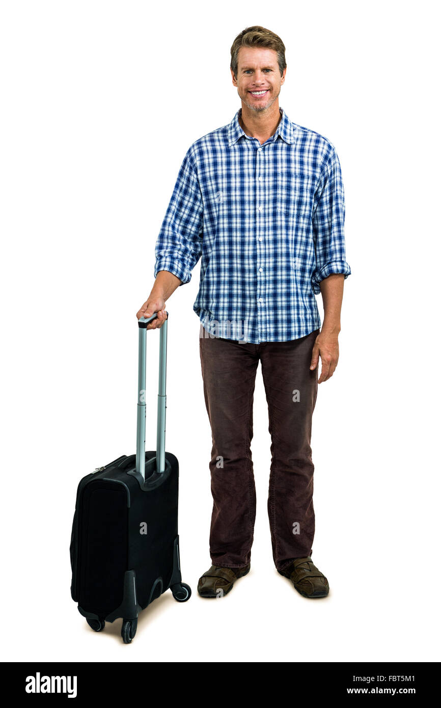 Cheerful man with luggage Stock Photo - Alamy
