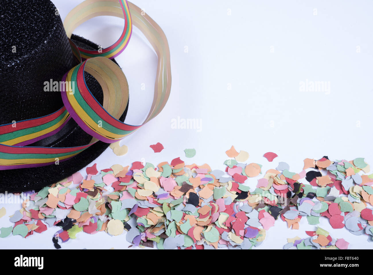 confetty and colorful streamers on white background Stock Photo - Alamy