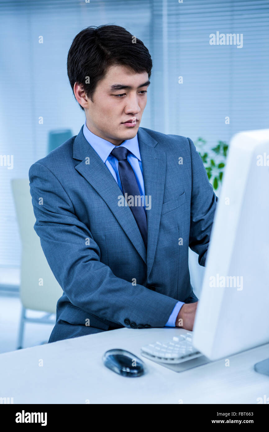 Businessman using his computer Stock Photo