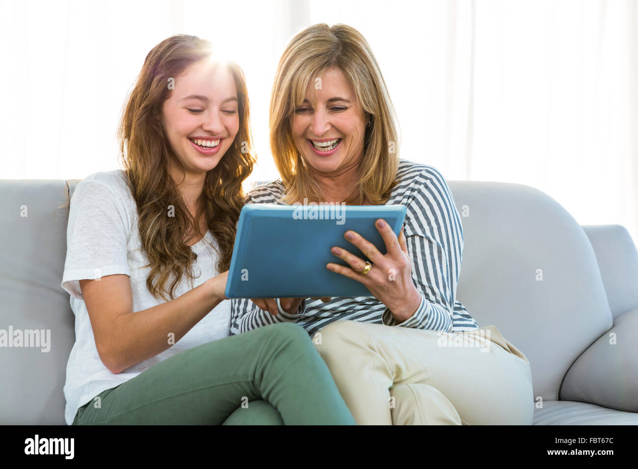Mother and daughter watch tablet Stock Photo