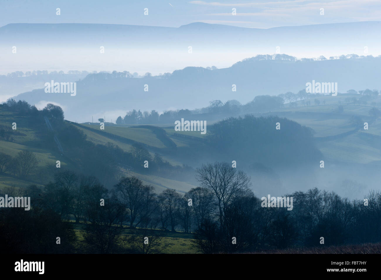 Powys, UK. 19th January, 2016. A view over the rolling hills of Mid Wales toward Hay Bluff and The Black Mountains (Powys) at sunrise. Credit:  Graham M. Lawrence/Alamy Live News. Stock Photo
