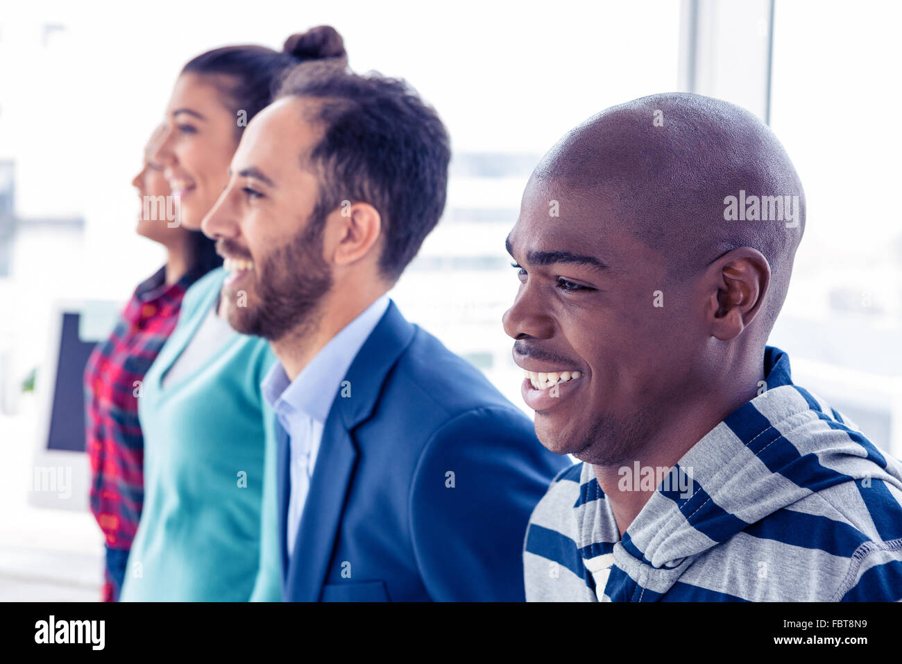 Happy business people standing in row Stock Photo