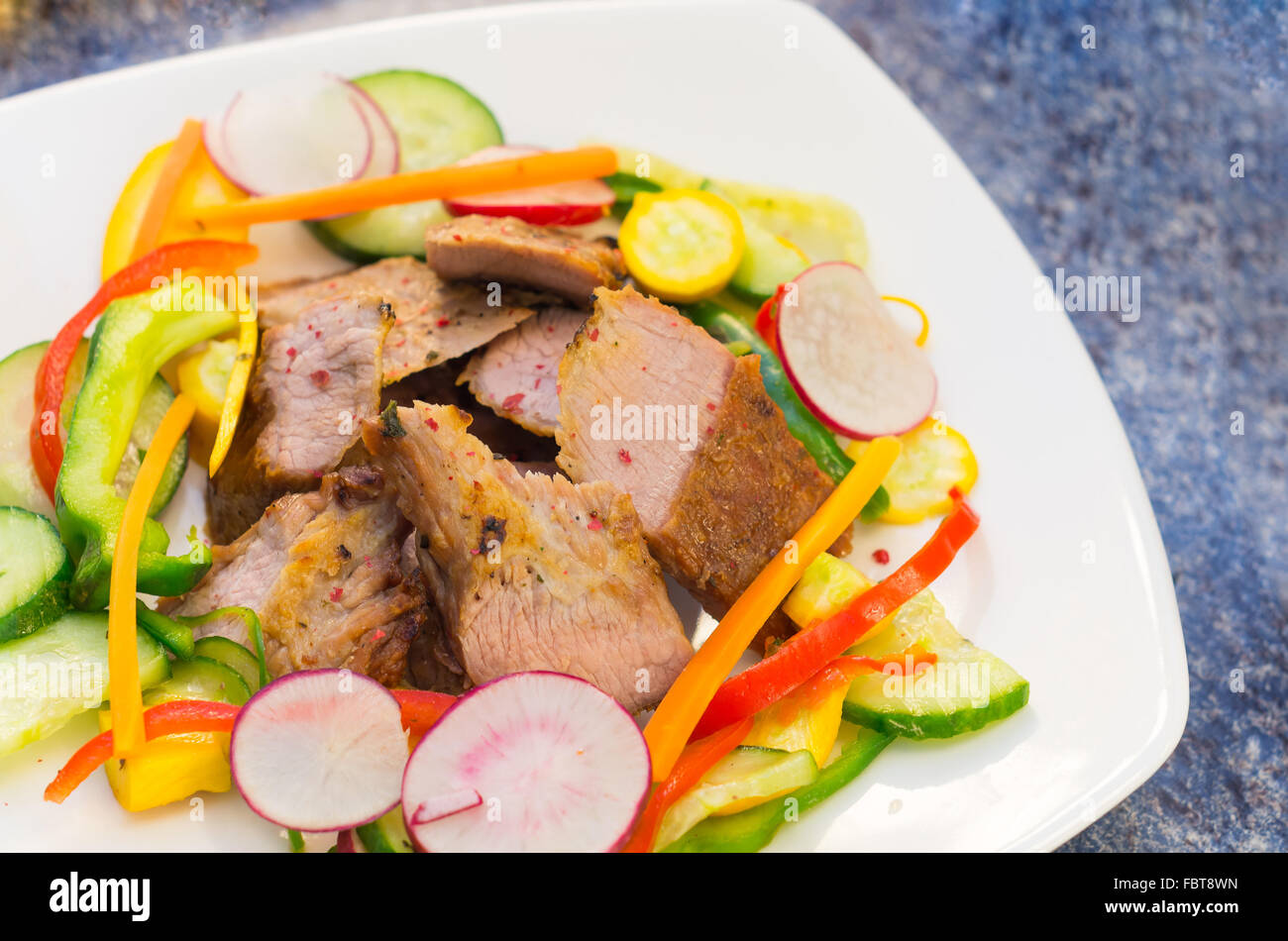 Delicious flank steak cuts cooked to perfection, mixed with reddish