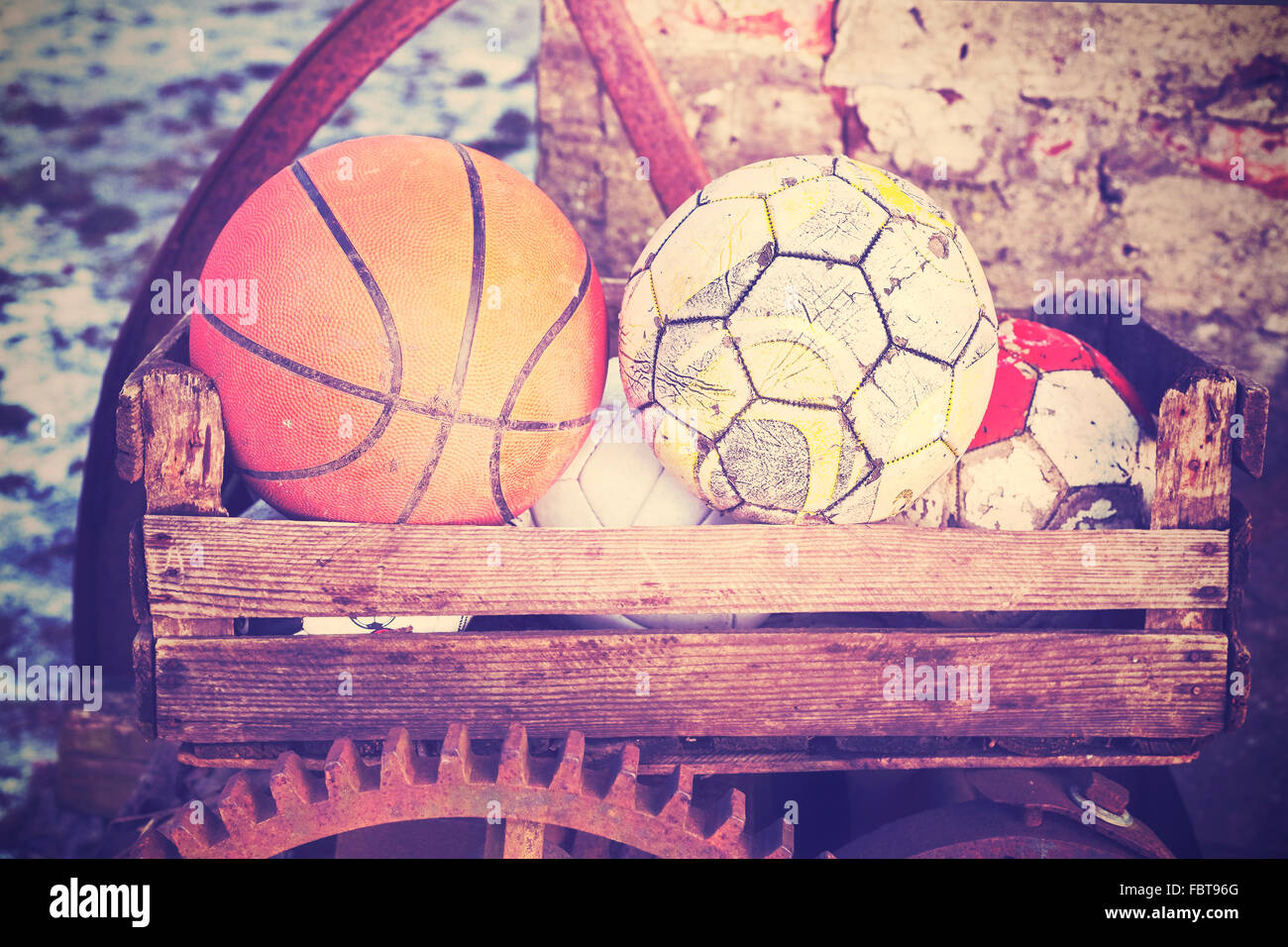 Vintage old film stylized used balls in a basket, shallow depth of field. Stock Photo