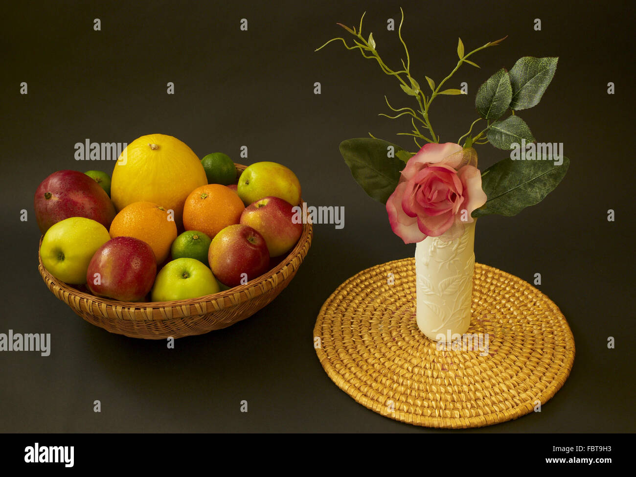 fruit bowle with vase and rose Stock Photo