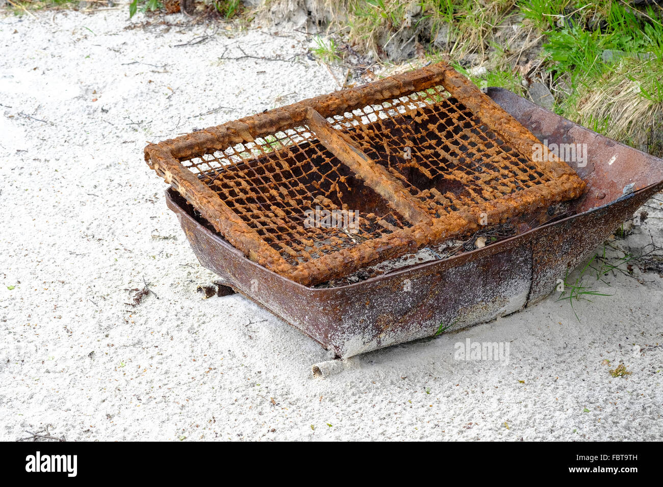 Rusty Barbecue left on Scottish beach at Morar Stock Photo
