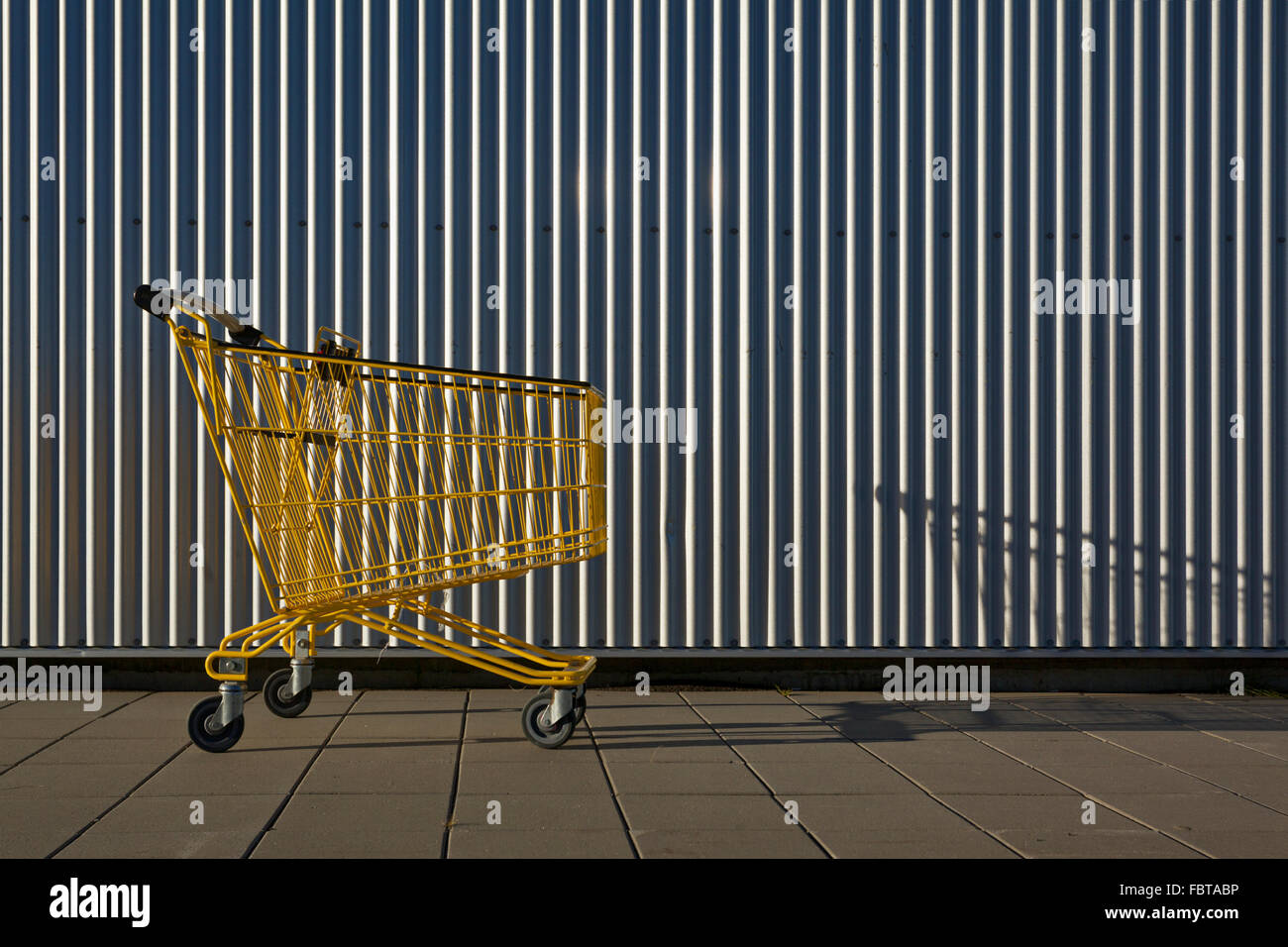 Yellow shopping trolley - abstract image Stock Photo