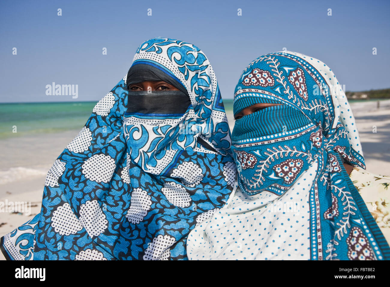 Veiled Muslim women on the beach Stock Photo