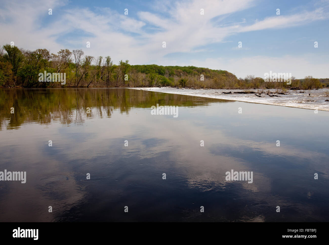 River Potomac in broad reflective view prior to the first dam on the river at Great Falls Stock Photo