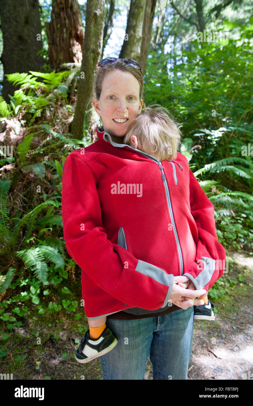 Woman hiking outdoors with young child Stock Photo