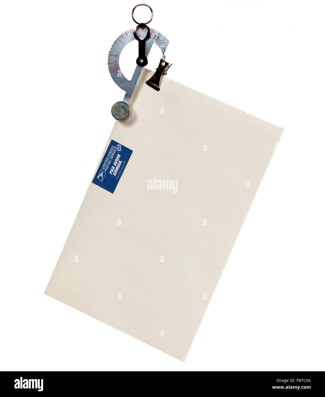 Small balance type scale weighing an envelope with airmail stamp Stock Photo Alamy