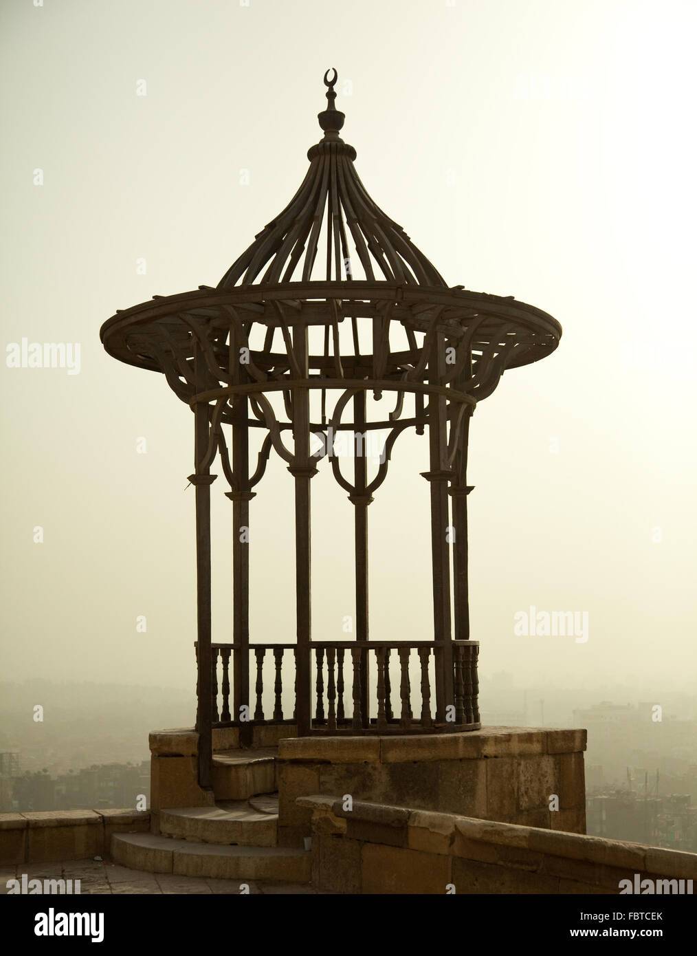 Old iron viewing place in the Citadel in Cairo in Egypt overlooking a misty and smoggy city Stock Photo