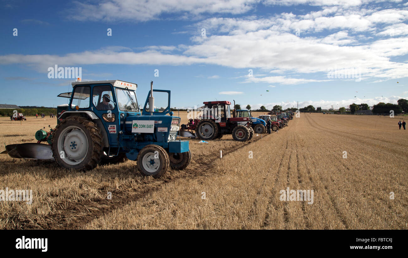 Tractors lined up to plough a field at the National Ploughing Championship in Ireland. Stock Photo