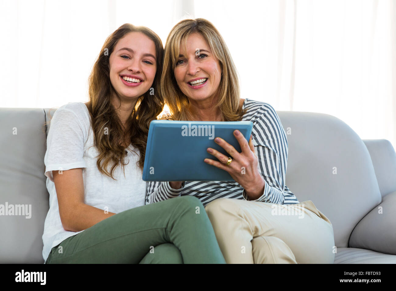 Mother and daughter use tablet Stock Photo