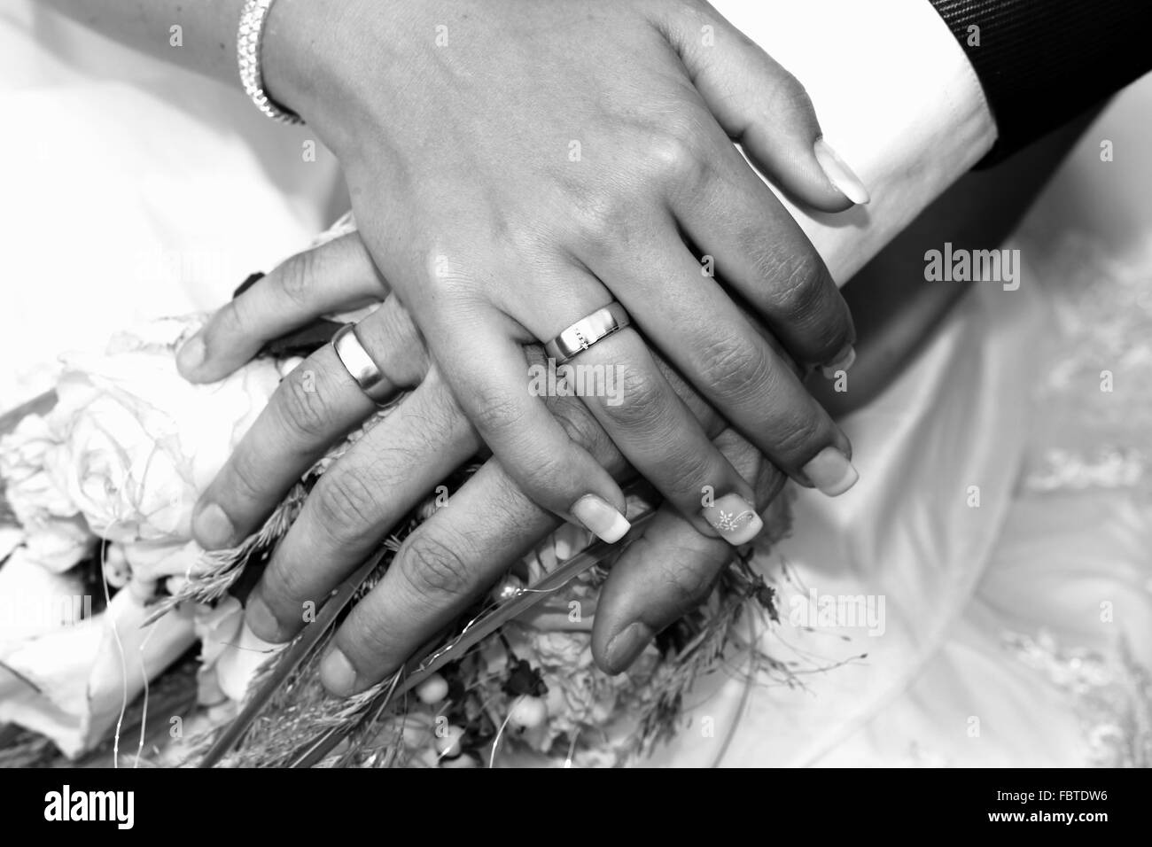Hands of a bride and groom Stock Photo