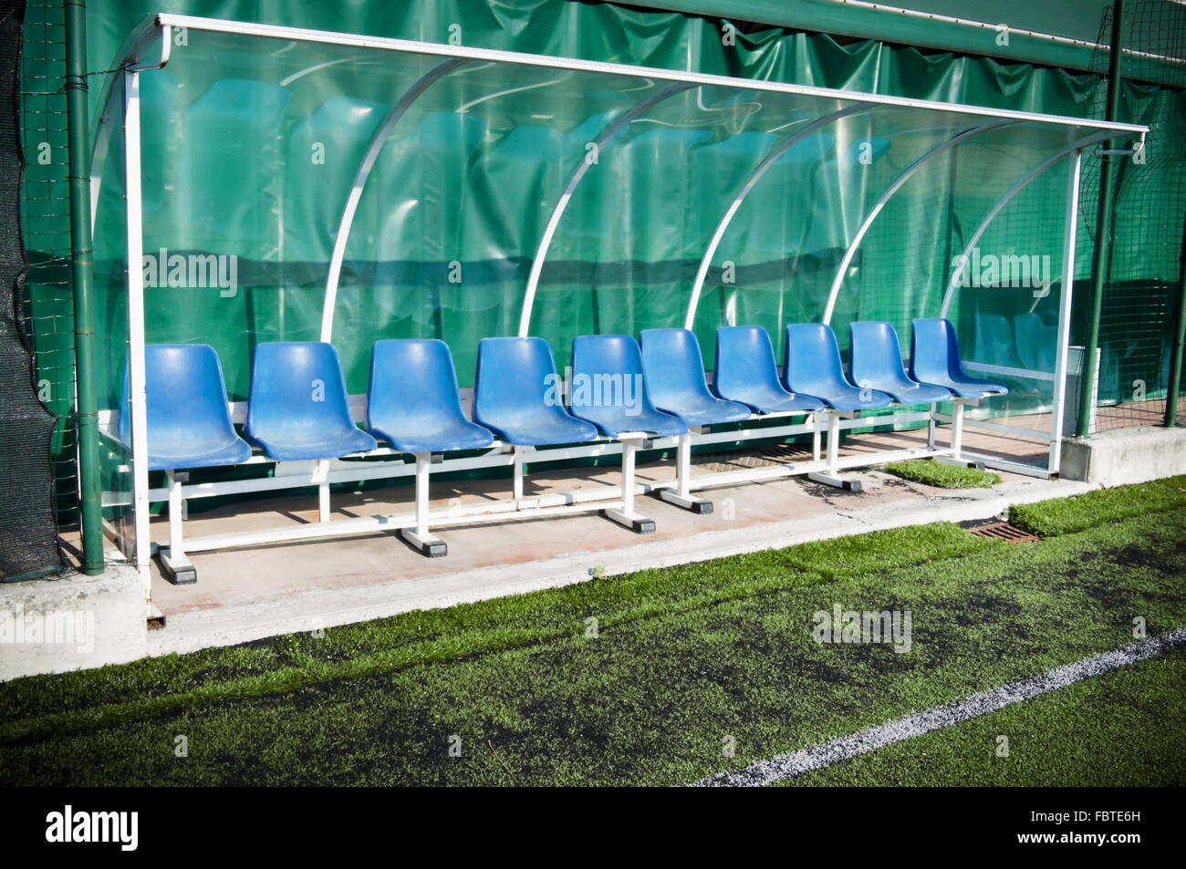 Coach and reserve benches in a soccer field Stock Photo Alamy