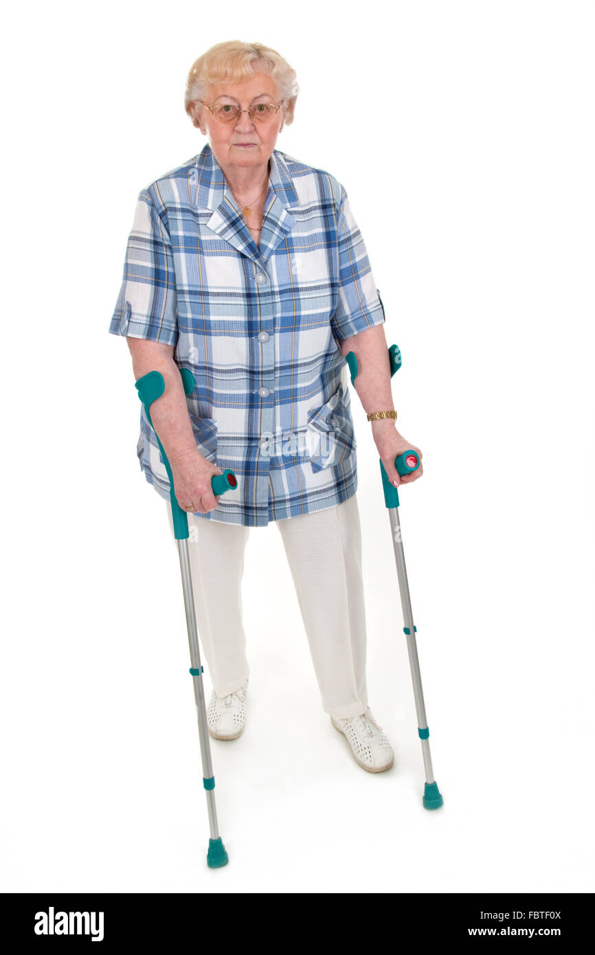 Old woman with crutches Stock Photo