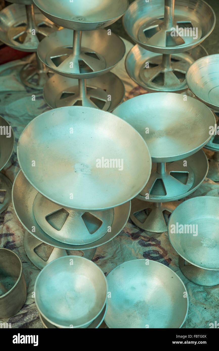 Numerous metal household dishes and bowls for sale at Kohima Market