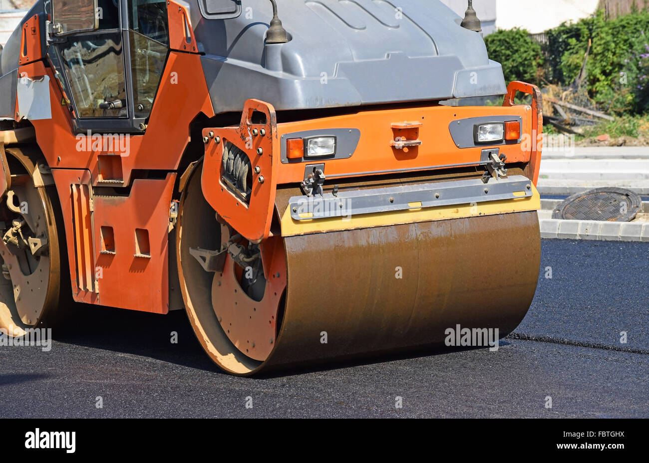 Steam roller is working at the road construction Stock Photo Alamy