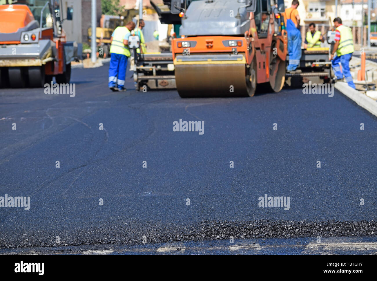 Steam rollers at the road construction in the city Stock Photo Alamy