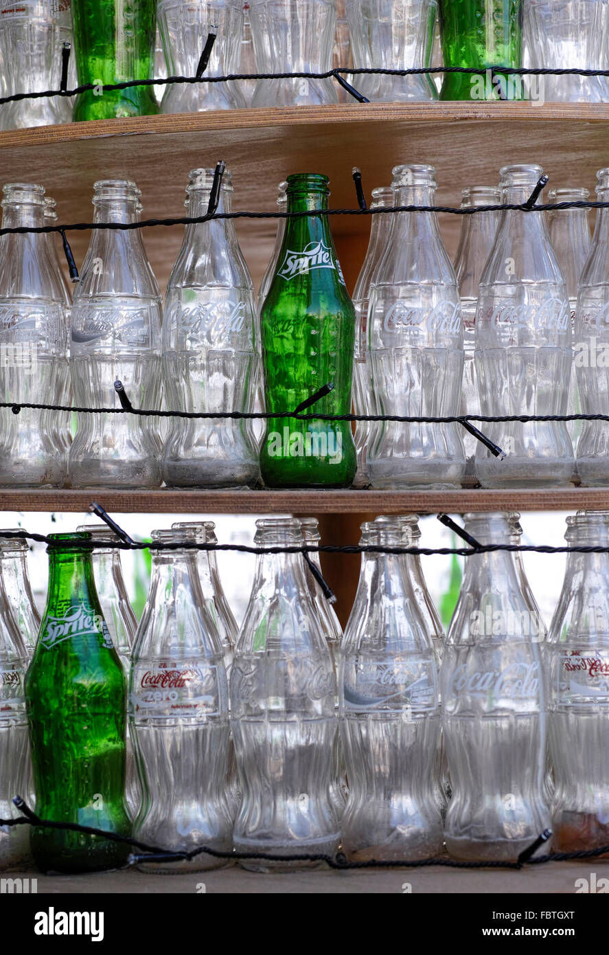 Paphos, Cyprus - December 11, 2015 Empty bottles of Coca-Cola and Sprite standing on shelves with lights. Stock Photo