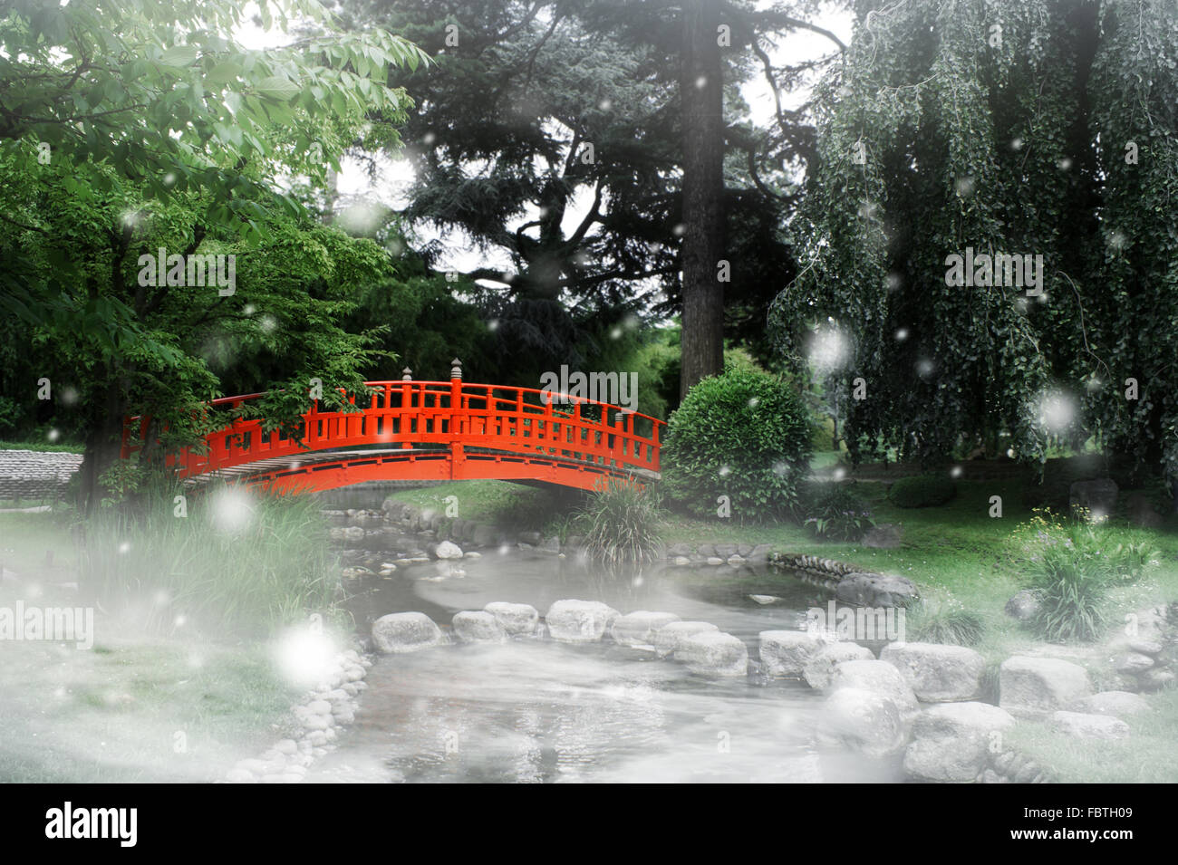 Red bridge in a japanese garden Stock Photo - Alamy