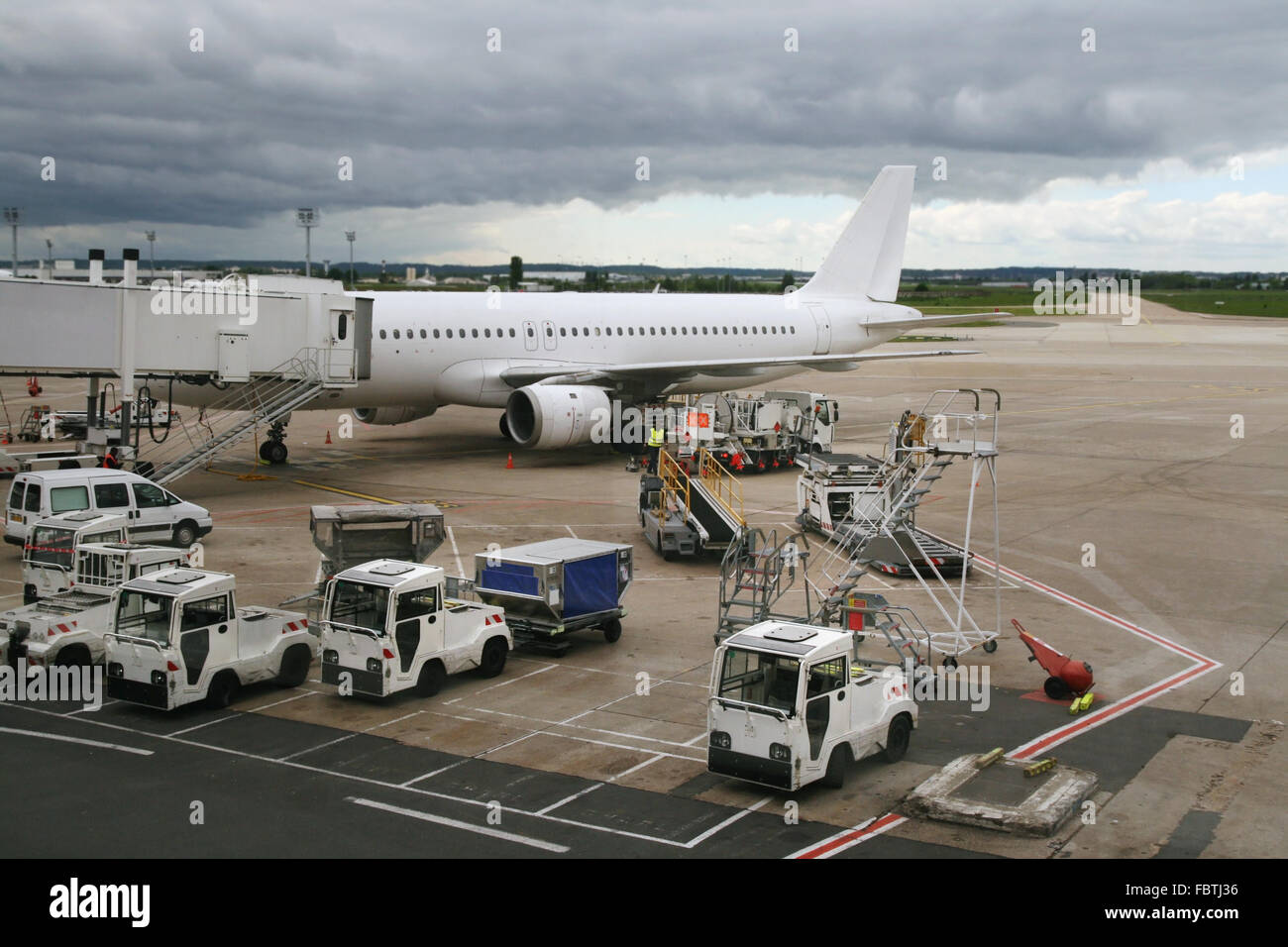 plane parked at the airport Stock Photo - Alamy
