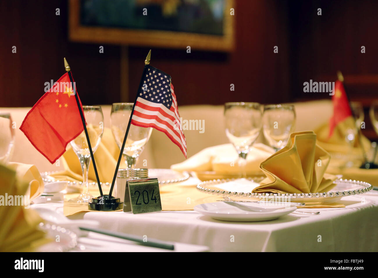 Set dining table with Chinese and American flags Stock Photo - Alamy