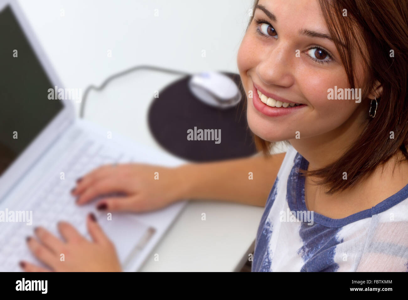 Young gril using laptop computer Stock Photo