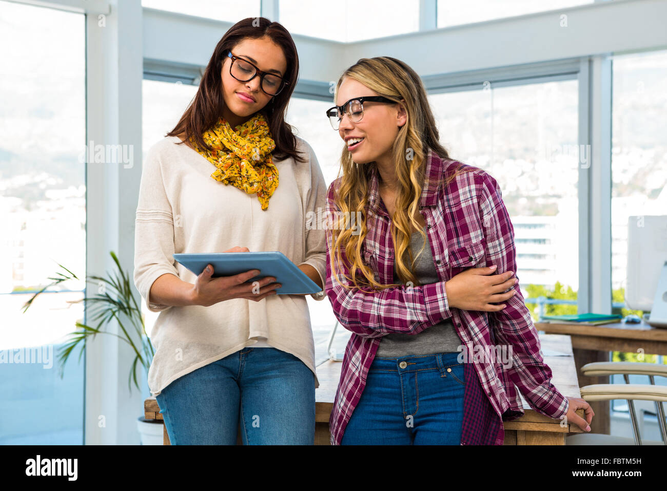 Two girls work at office Stock Photo